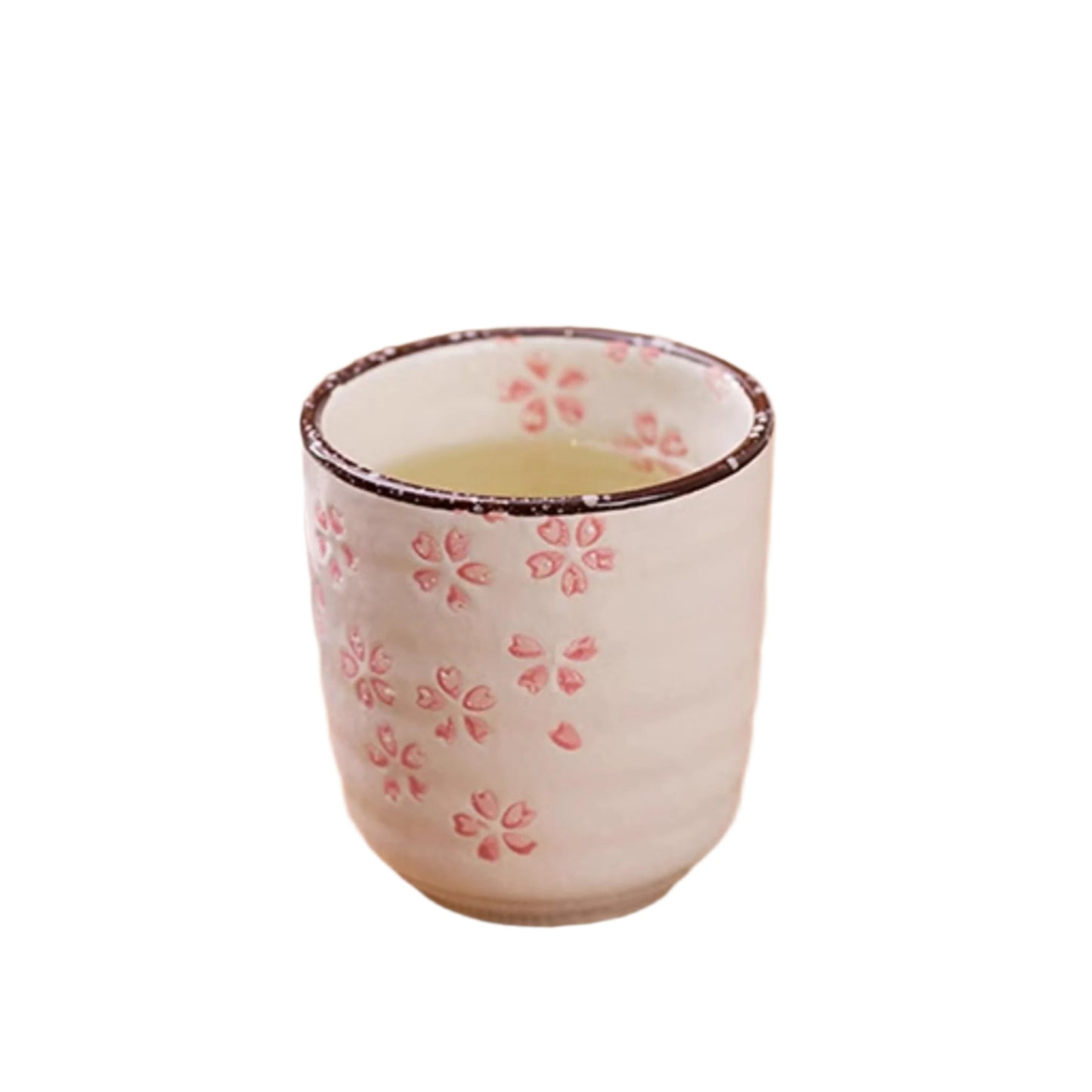 Tea cup with floral design on a wooden surface with flowers and a plate.