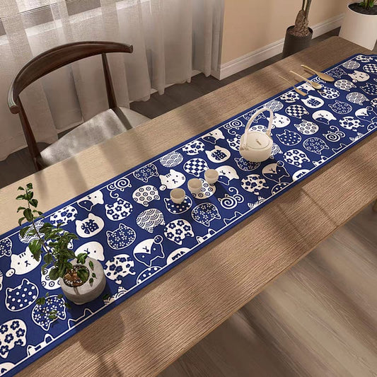 Table runner with cat pattern on a wooden table