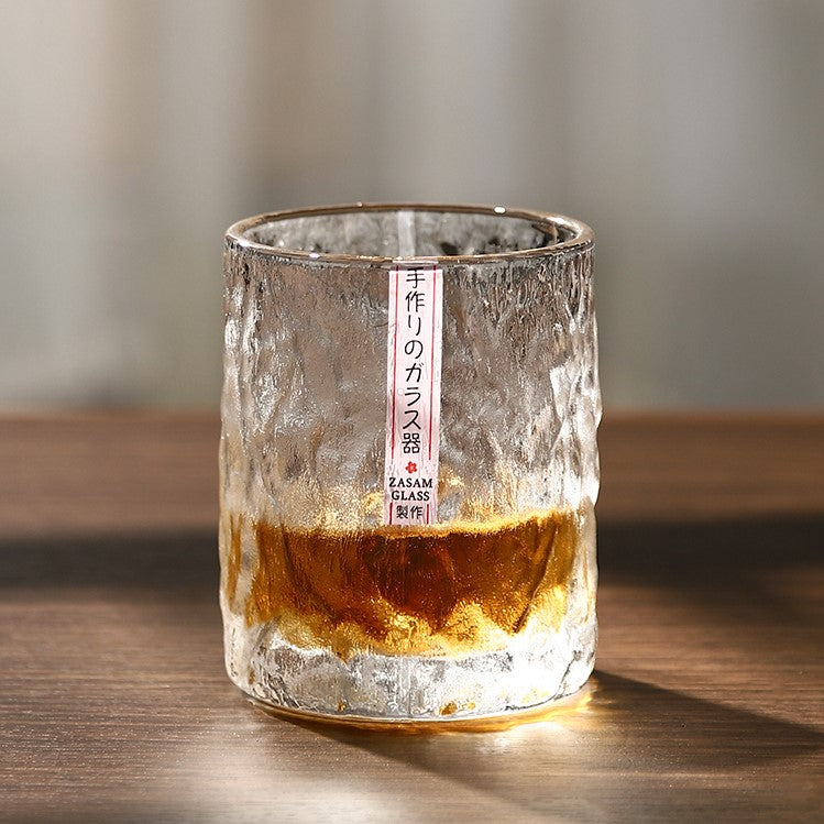 https://sakeoni.com/cdn/shop/products/japanese-hammered-whiskey-glass-tumbler-with-wine_1445x.jpg?v=1640423092